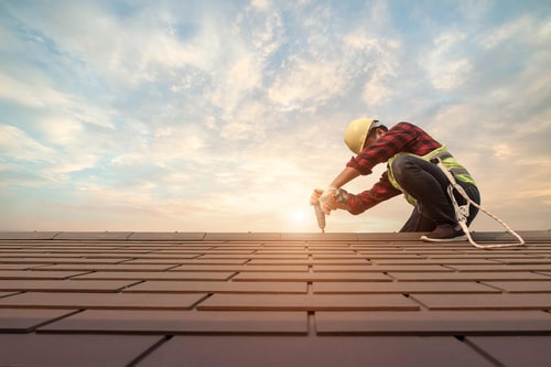 A man working on a roof, image for residential roofers in Atlanta